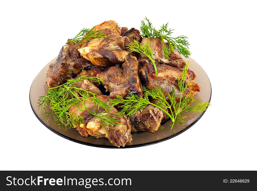 Fried meat on stones on a white background