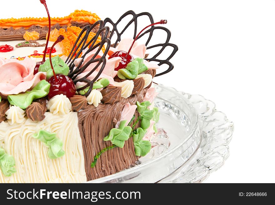 Cream cake with cherries isolated on a white background