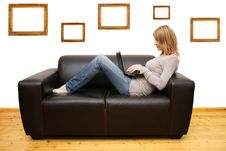 Young Woman Lying On A Sofa And Using A Laptop Stock Image Young Woman Lying On A Sofa And Using A Laptop Stock Image