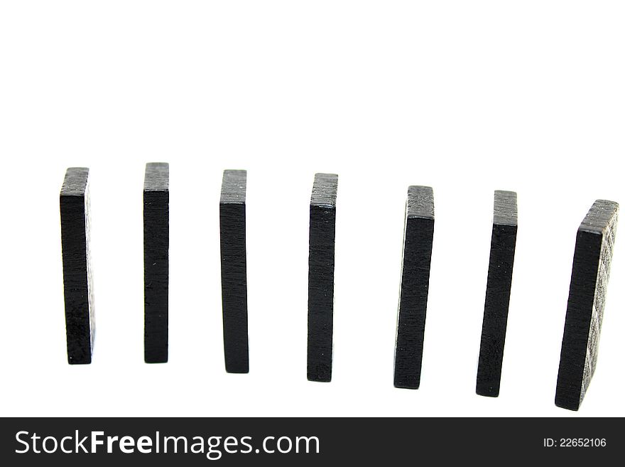 Row of dominoes on white background