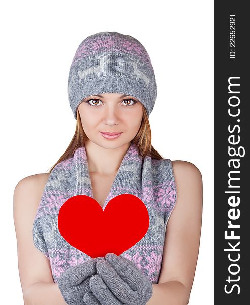Beautiful young woman holding a heart, isolated on white background