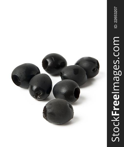 Black olives in a bowl  on white
