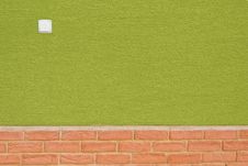 Green Wall With Bricks On Bottom And White Switch Stock Photography Green Wall With Bricks On Bottom And White Switch Stock Photography