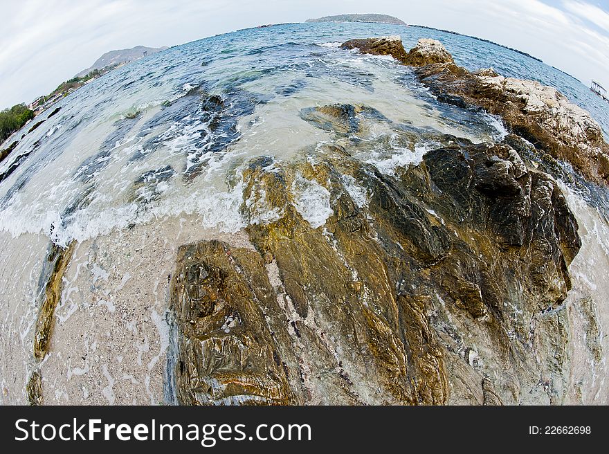 Curve of sea and wave on the rock in the island