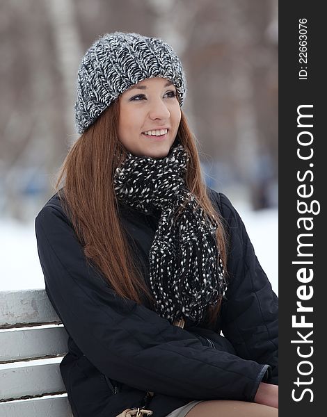 Girl Sits On A Bench