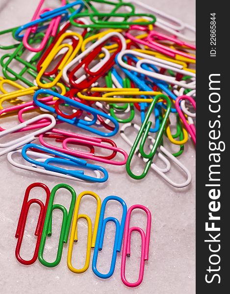 Heap of paper-clips in many colors