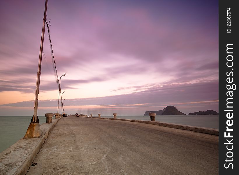 Lonely pier with dramatic cloudy while sunrise. Lonely pier with dramatic cloudy while sunrise