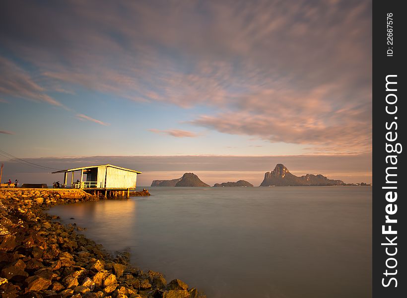 Lonely pier with dramatic cloudy while sunrise. Lonely pier with dramatic cloudy while sunrise