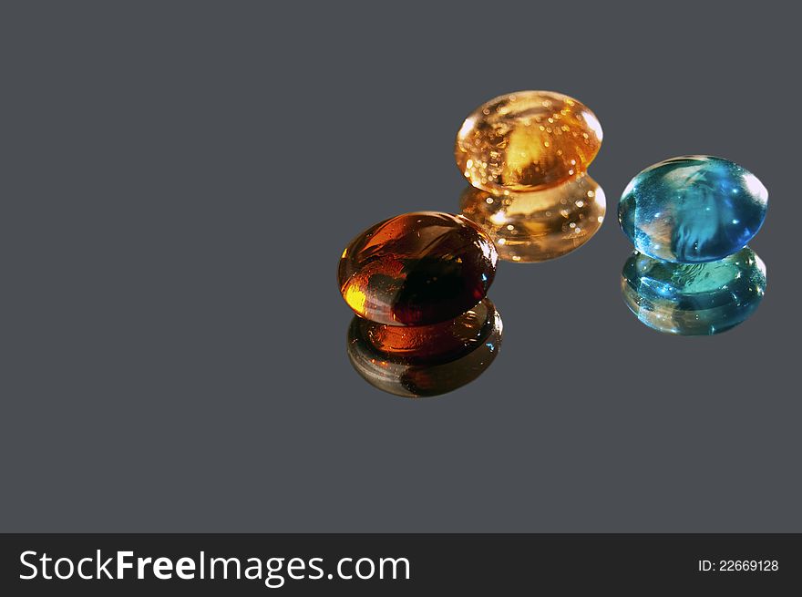 Glass stones on a gray background