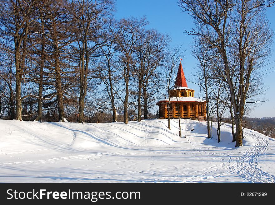 Wooden arbor in park in the winter