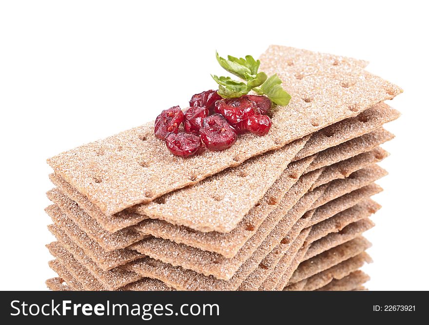 Stack of crispbread on white background ,reflection, blueberry red, green leaf