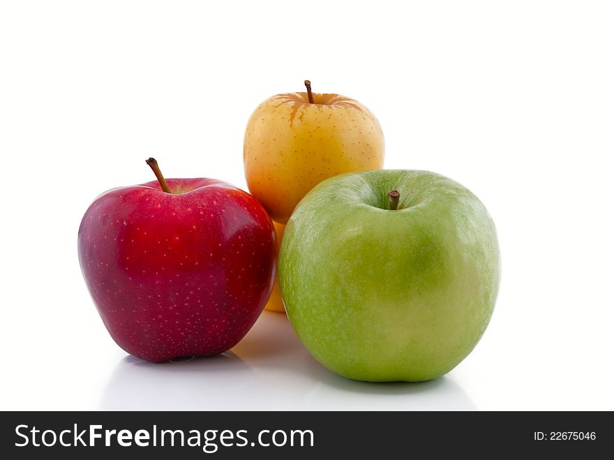 Red, green and yellow apples with reflection. Red, green and yellow apples with reflection