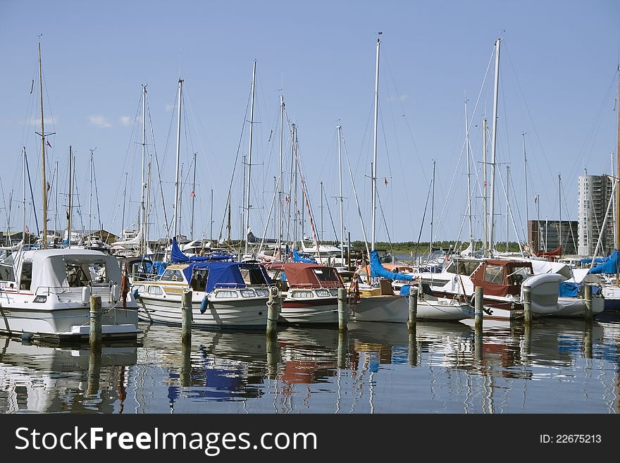 Small yachts in a harbour in a sunny day. Small yachts in a harbour in a sunny day