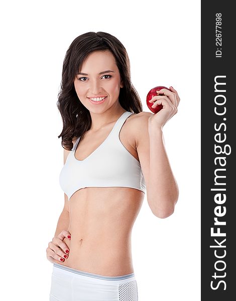 Yound fit girl holding red apple