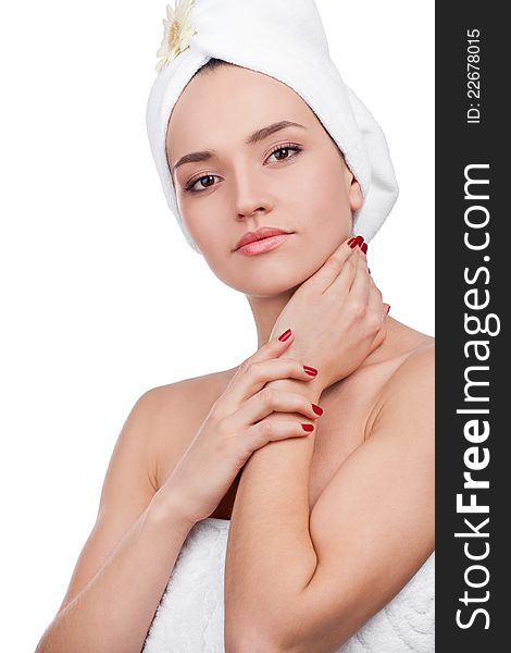 Beautiful woman in towel on head touching her clean face. Beautiful woman in towel on head touching her clean face