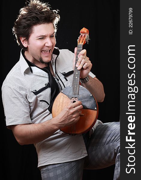 Young Man With A Musical Instrument