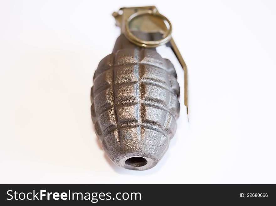 Close-up view of a hand grenade with white background