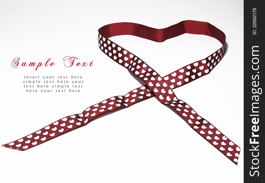 Red satin ribbon with heart shape,a picture for writing a text and sending to your love guy. Red satin ribbon with heart shape,a picture for writing a text and sending to your love guy.