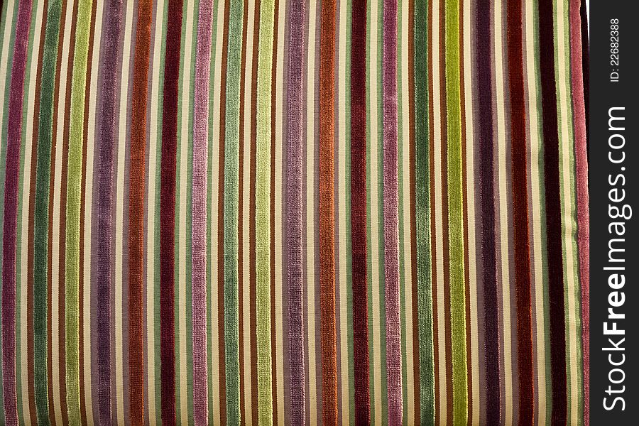 A colorful, soft, fuzzy, striped background from a Chenille fabric upholstered chair. A colorful, soft, fuzzy, striped background from a Chenille fabric upholstered chair.