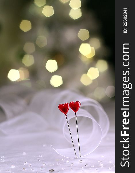 Image of a red heart pins with ribbon on valentines day