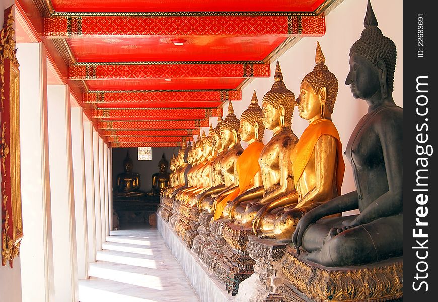 Buddha in corridor of light in wat pho temple,bangkok,