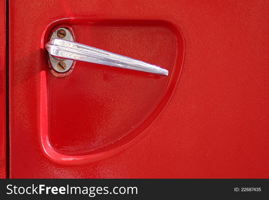 Detail of the door handle of a 60's firetruck. Detail of the door handle of a 60's firetruck