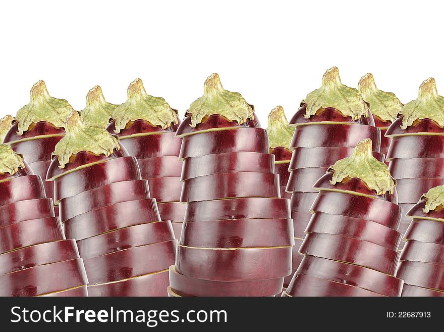 Many sliced aubergines (eggplants) on a white background with copy space. Many sliced aubergines (eggplants) on a white background with copy space