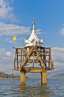 Part Of Thai Church Bell Tower Expose In The River Stock Image