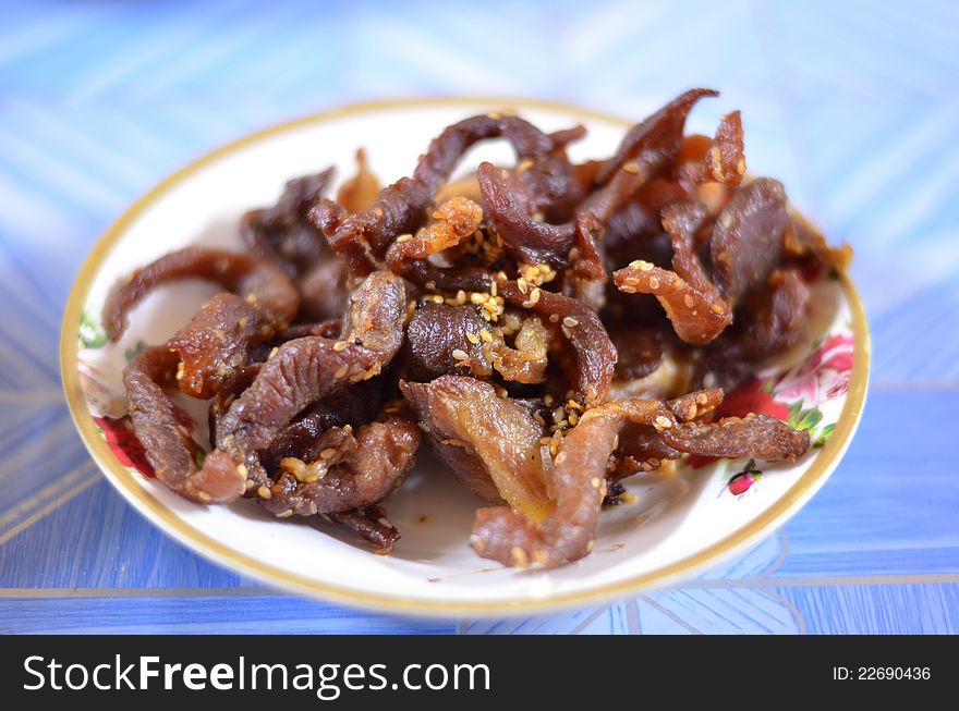 Beef jerky with sesame on dish
