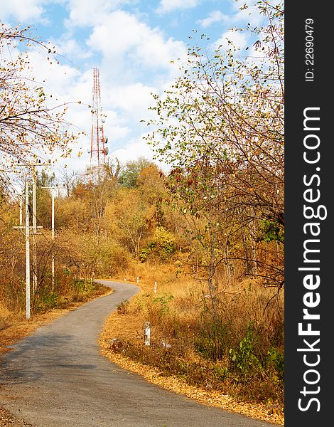 Mountain Road in autumn, leading to a telecommunications tower