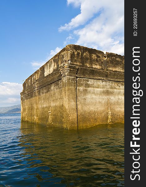 Part of ruin of Thai church expose in the river