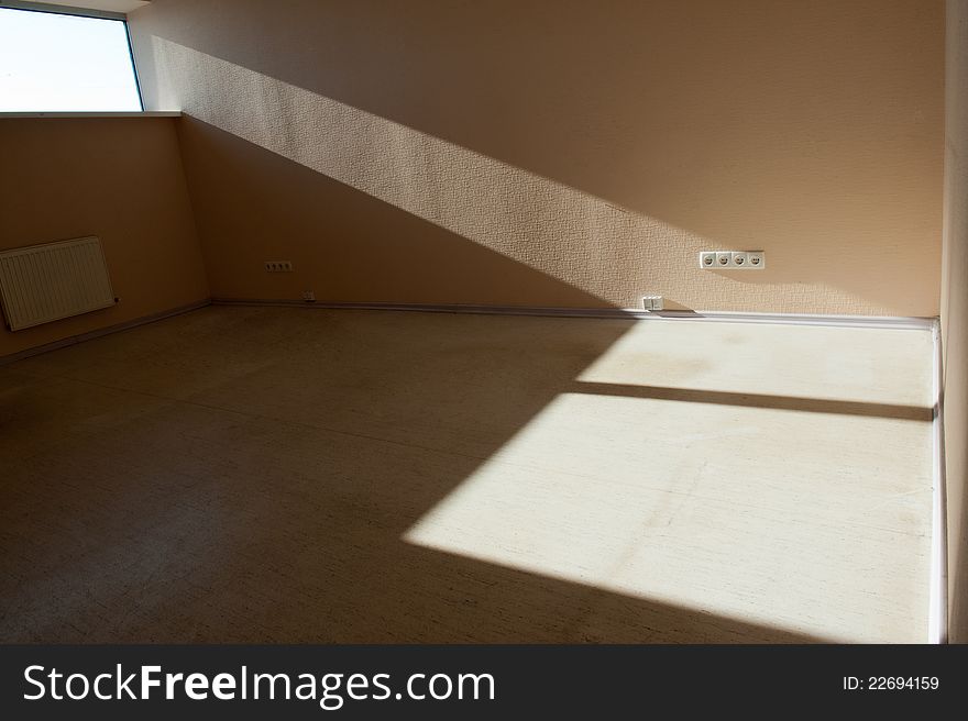 Picture of empty room with daylight flowing through the window and left  shadow on the floor. Picture of empty room with daylight flowing through the window and left  shadow on the floor