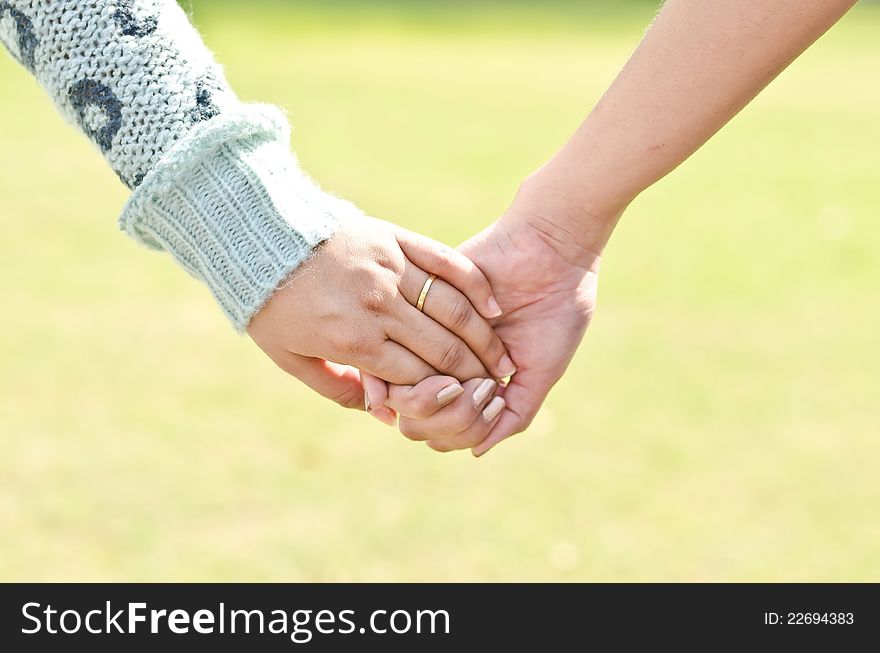 Woman's Hand holding hand, lesbien concept