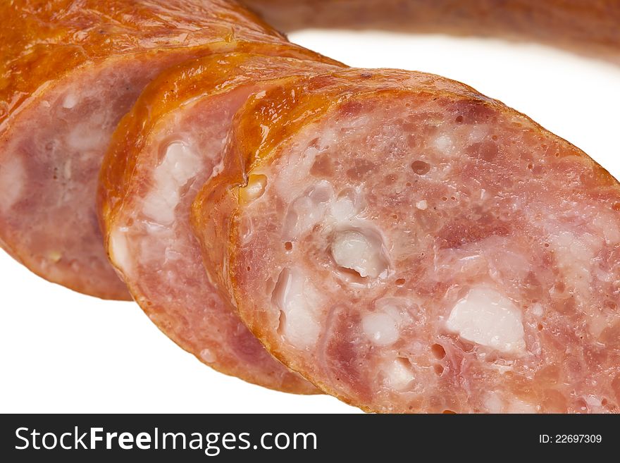 Sliced sausage on a white background isolated. This has a clipping path. Sliced sausage on a white background isolated. This has a clipping path.