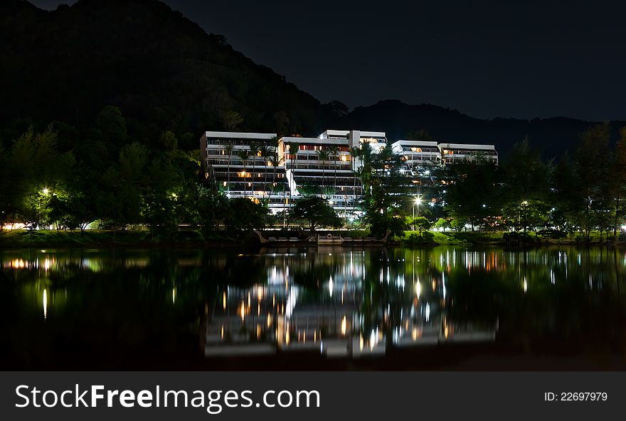 Hotel at night, the reflection in the sea