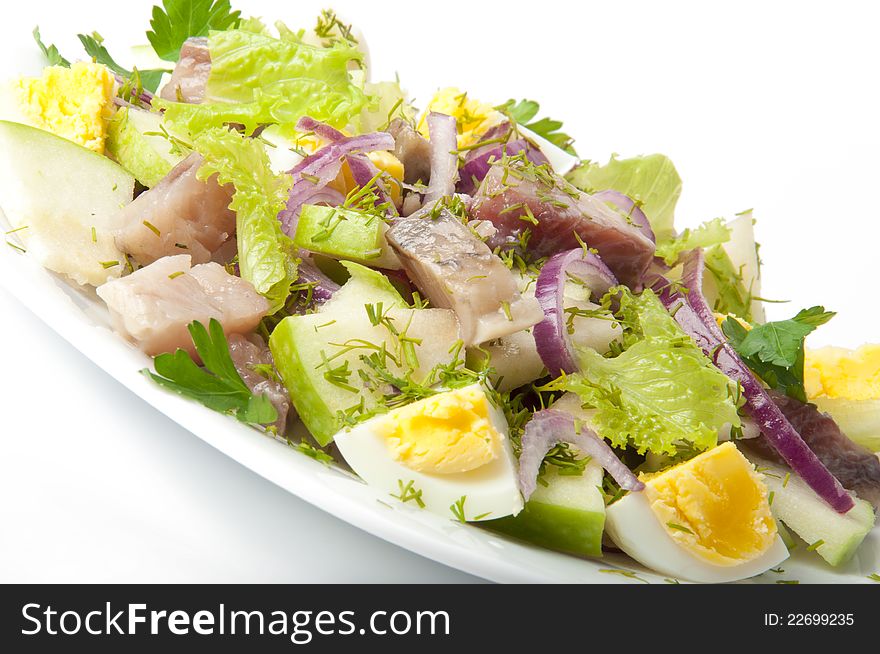 Herring salad on a white background. Herring salad on a white background