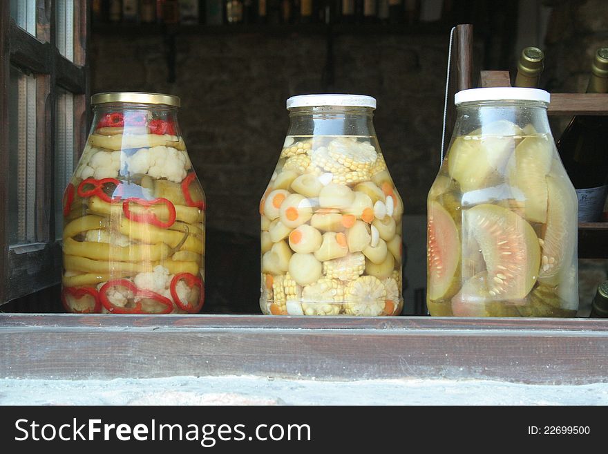 Glass jars of pickled vegetables. Decorative used in the kitchen.