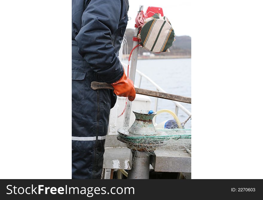 Fisherman working on a norwegian fishingboat. Fisherman working on a norwegian fishingboat