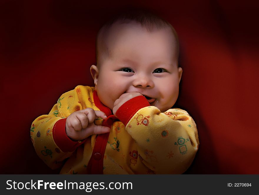 Baby portrait on red background