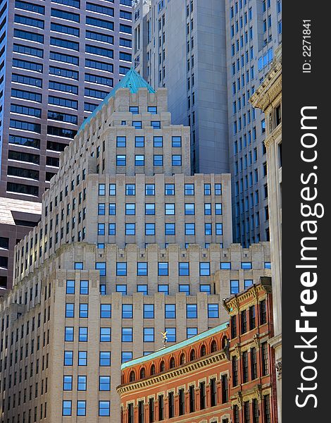 New buildings towering over the old in boston's downtown district. New buildings towering over the old in boston's downtown district