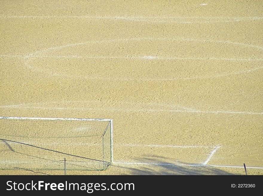 An empty dirt soccer field. An empty dirt soccer field.