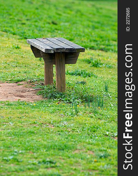 A bench on a green grass