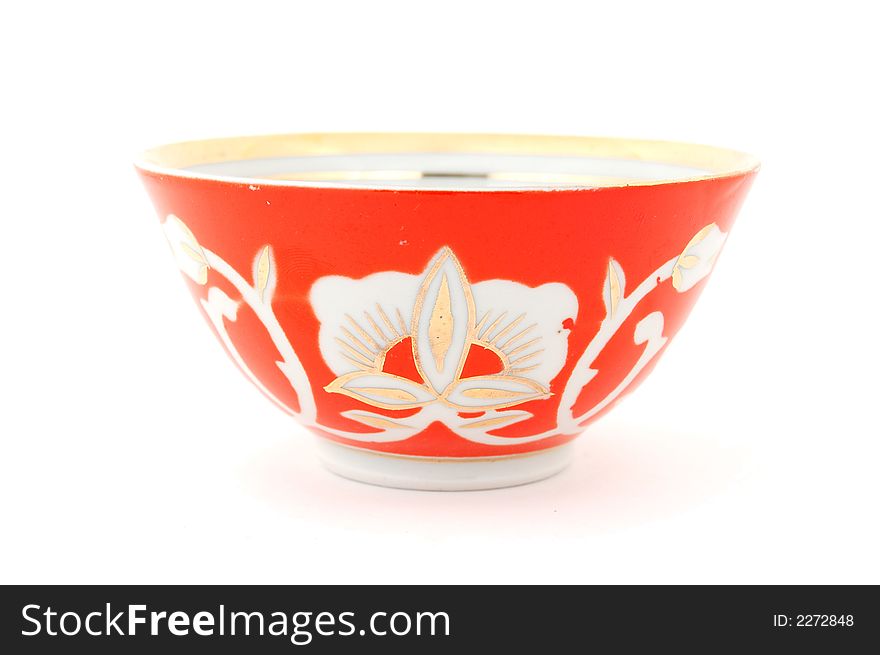 Isolated photo of red Central Asian (Uzbek) tea cup (piala) with traditional cotton style pattern. Isolated photo of red Central Asian (Uzbek) tea cup (piala) with traditional cotton style pattern.