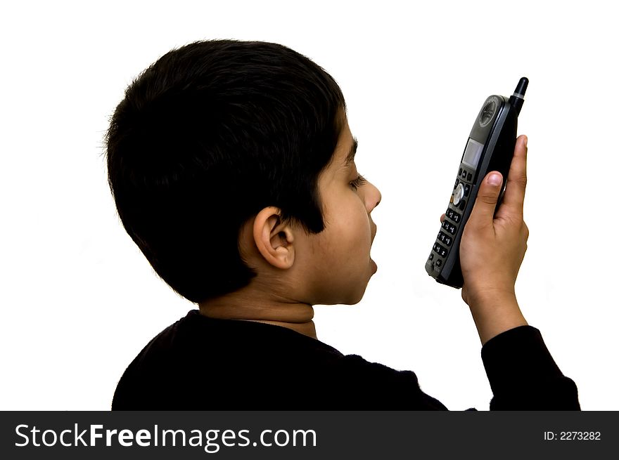 A kid speaking on the phone loud using the speaker phone