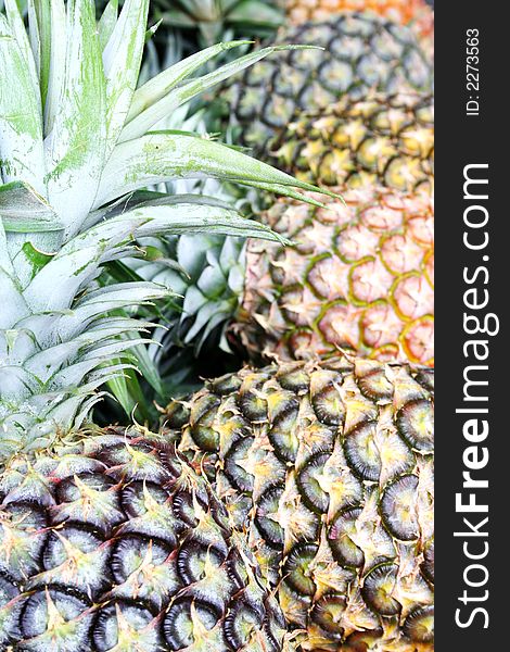 Close up of pineapples in a Philippine fruit stand for background use