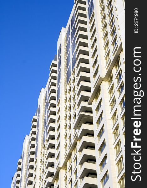 Balconies on a wall of the multi-storey house. sky. monolith