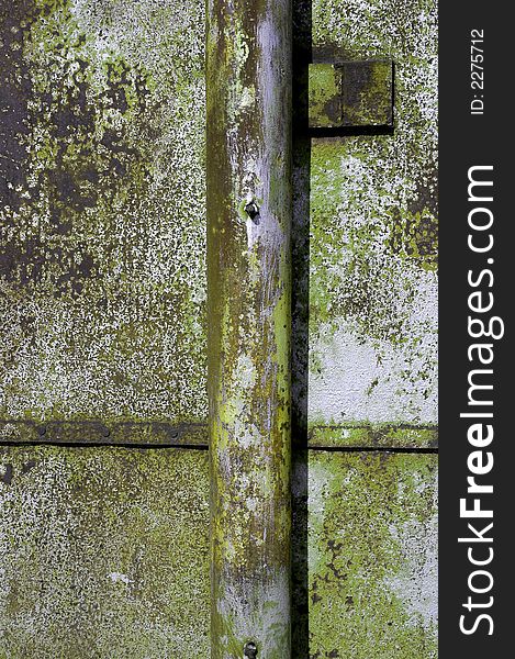 Detailed closeup of colorful rusty sheet of old metal with rivets. Detailed closeup of colorful rusty sheet of old metal with rivets