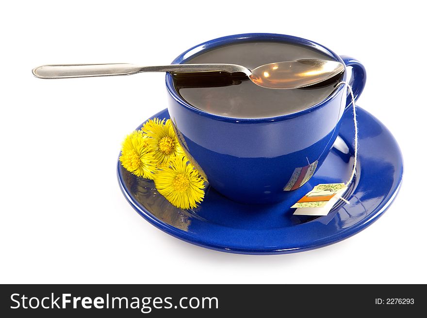 Strong spring fragrant tea in a dark blue cup. Strong spring fragrant tea in a dark blue cup