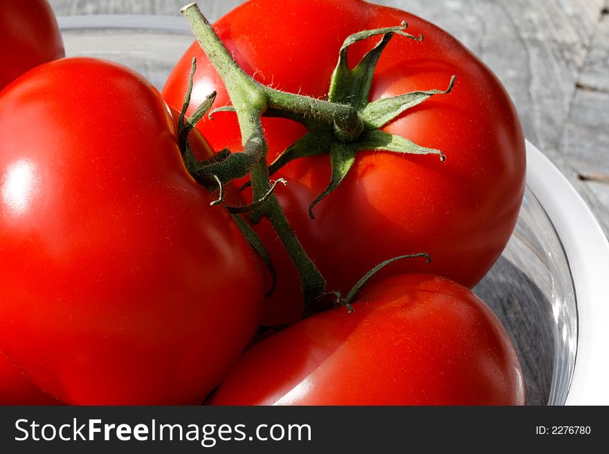 Tomatoes on a glass plate close-up