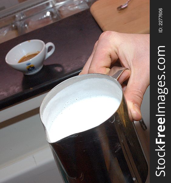 View of fresh milk and the cup of coffee. View of fresh milk and the cup of coffee